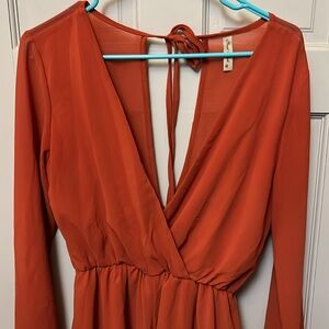 Burndt Orange romper long sleeve size m  lined on front and shorts area